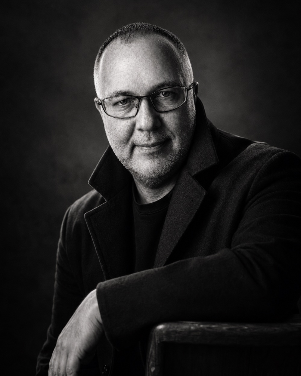 Black-and-white portrait of Simon Stevens, the artist behind SIMFORNIX